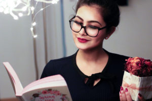 Woman in glasses reading book